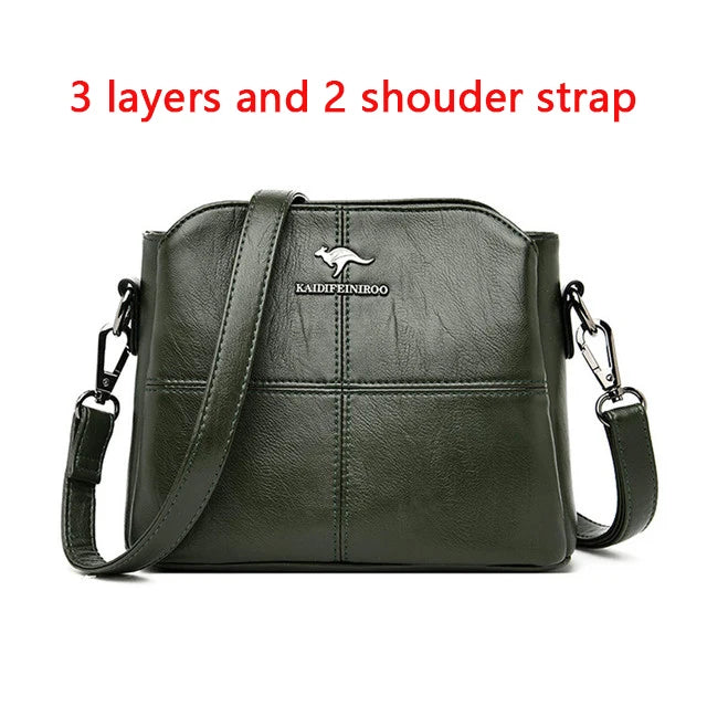 Green leather shoulder bag with 3 layers and two straps.