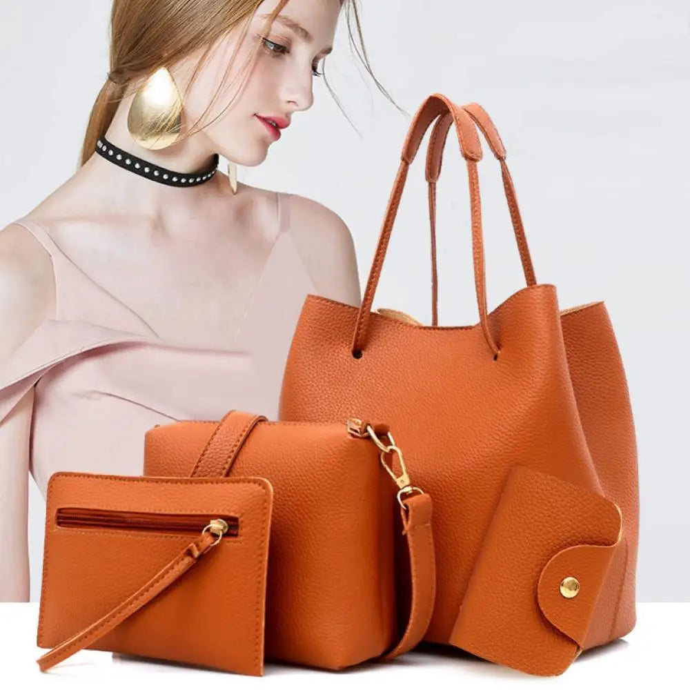 Orange leather tote bag set with matching wallet and pouches.