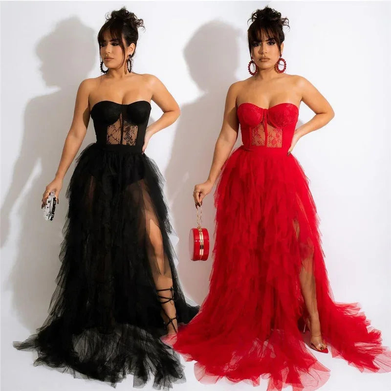 Two women wearing black and red strapless tulle dresses with high slits.
