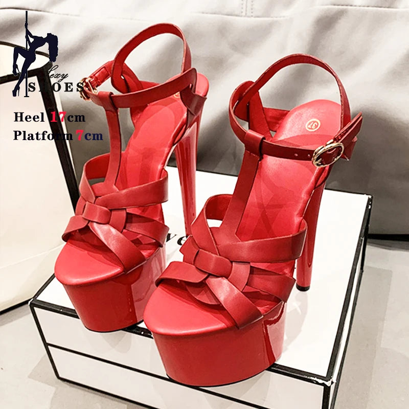 Red high-heeled platform sandals with ankle straps and thick heel.