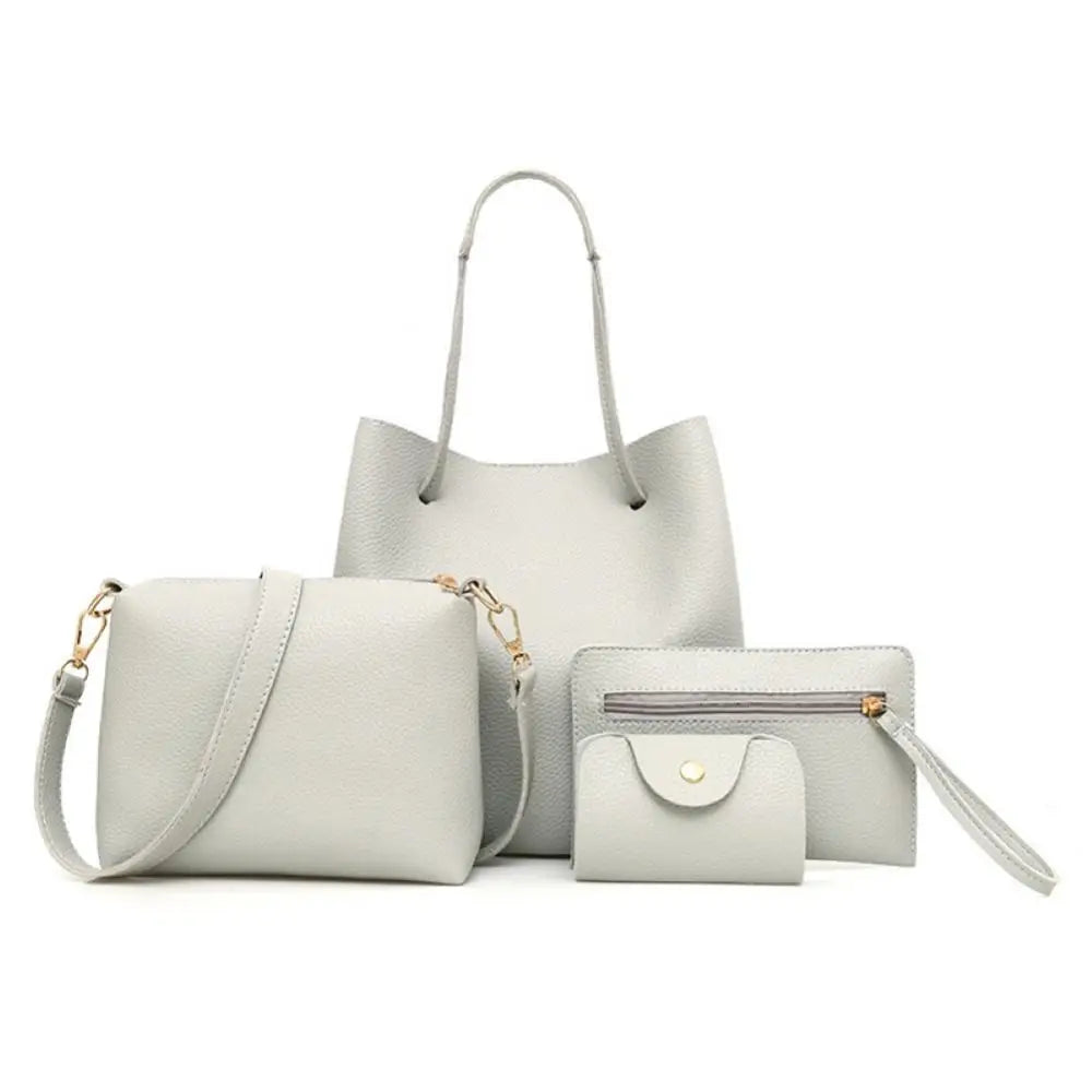 Set of four light gray leather handbags with gold hardware on a white background.