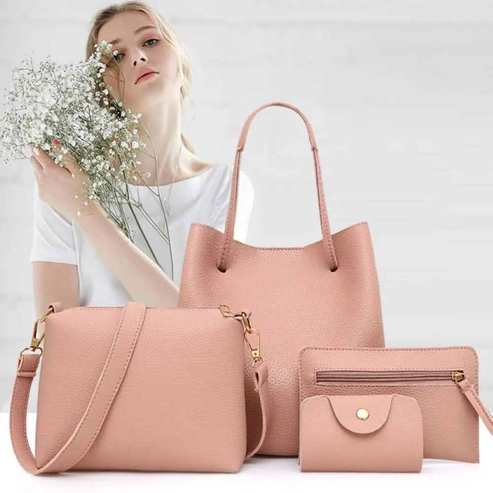 Pink leather handbag set with matching wallet and pouch, displayed on a white surface.